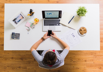 Sticker - woman with smartphone and laptop at office table