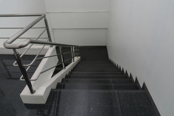 Old staircase with a handrail in a building