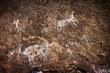 A group of hunters and animals, rupestrian rock art in Sumbay Cave from paleolithic era (6000-8000 BC), Arequipa departement, Southern Peru