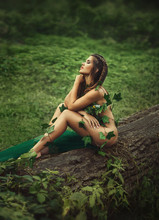 Sexy Girl In Clothes From Leaves. Fantasy Picture. Creative Colors