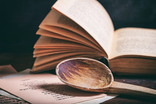 Wooden Spoon And A Vintage Book