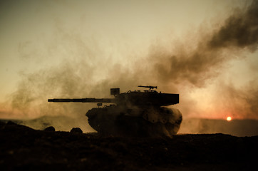 Wall Mural - War Concept. Military silhouettes fighting scene on war fog sky background, World War Soldiers Silhouettes Below Cloudy Skyline At sunset. Attack scene. German tank in action