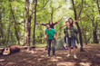 © deagreez - Chill, fun, joy, love and friendship! Four friends are fooling around in a wood at a campground, boys piggyback their ladies