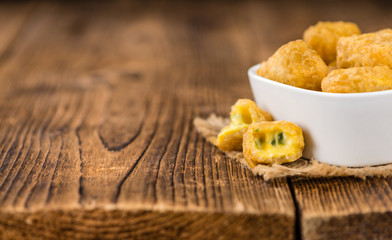 Wall Mural - Cheese Nuggets (with Chilis) (selective focus, close-up shot)