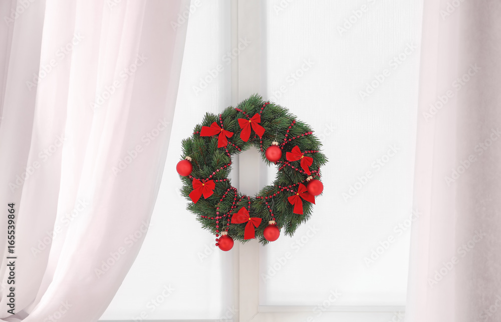 Beautiful trendy Christmas wreath on window