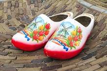 Typical Dutch Wooden Clogs (klompen), Painted With Tulips And A Windmill