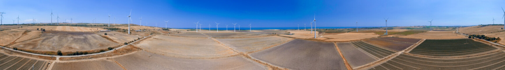 Panoramic aerial view of industrial windmills plant