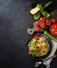 Wall Mural - whole grain spaghetti pasta with shrimps, top view, copy space