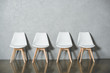 © LIGHTFIELD STUDIOS - white empty chairs for job interview standing in line in hall