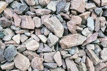 Small Rock Crushed Stone Road-metal. Pile Of White, Grey And Yellow Rocks. Road-metal Background