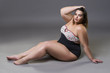 © staras - Plus size fashion model in sexy swimsuit, young fat woman on gray background, overweight female body