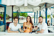 © nazarovsergey - Friends toasting in summer vacation in a bar terrace on the beach