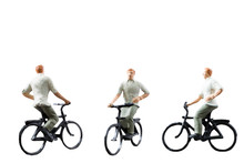 Miniature Figure Ride Bicycle Isolated On White Background
