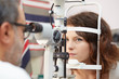© Stocked House Studio - pretty young woman having her eyes examined by an eye doctor