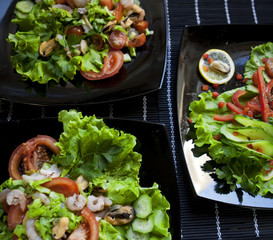 delicious salad over black plate