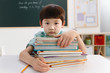 © View Stock - Portrait school boy with stack of books