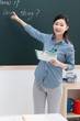 © View Stock - Teacher teaching in classroom