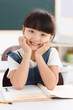 © View Stock - Portrait of a girl sitting in classroom