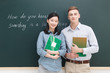 © View Stock - Two teachers standing in front of blackboard