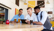 © Syda Productions - male friends with tablet pc drinking beer at bar