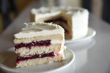 Layered Sponge Cake With White Frosting And Jam Filling