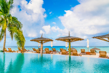 Swimming pool bar in tropical Maldives island .