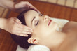 © Acronym - Beautiful girl getting face lifting massage in spa salon. Health care, rejuvenation and relaxation concept.