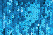 background, strewn with blue sequins, glitter sequins blue
