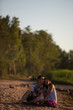 © viktoria_koks - A young couple in love, on the shore of the Bay at sunset