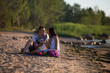 © viktoria_koks - A young couple in love, on the shore of the Bay at sunset