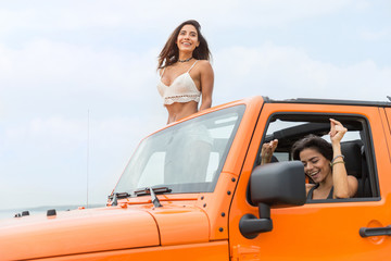 Sticker - Two attractive young women laughing and having fun