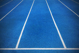 Fototapeta  - Blue color running tracks on athletics stadium