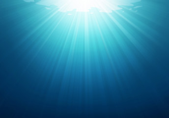 underwater blue sea background photo with with sun and sunlight shining under the sea.