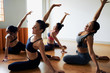 © DragonImages - Sporty Women Doing Stretching Exercises