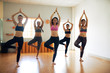 © DragonImages - Portrait of Cheerful Yoga Practitioners