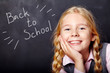 schoolchild on blackboard background