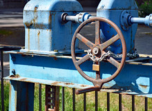 With A Lock Secured Wheel On A Water Sluice 