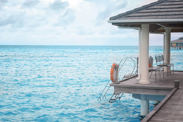 Poster - View of sea and shelter shed at resort on summer day