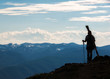 © Aaron - A backcountry skier silhouetted on a high mountain peak