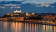 Bratislava castle at night with light reflection on the dunaj river on right riverside.
