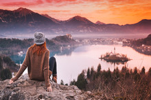 Traveling Young Woman Looking On Sunset On Bled Lake, Slovenia, Europe