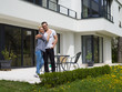 © .shock - couple hugging in front of  new luxury home