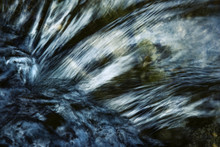 Detail Of A Dark Ripple On The River