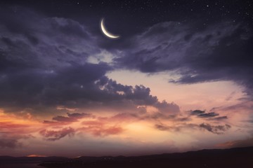 prayer time . dramatic nature background . red sunset and moon . ramadan background . arab night . p
