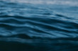 © Jan Bijl/Stocksy - ripples in ocean water at dusk