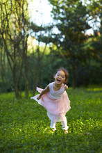 Lovely Little Asian Girl In Garden