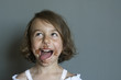 A happy child who has eaten chocolate remembers how delicious he was.