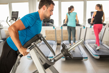  fit young man exercise at the modern gym