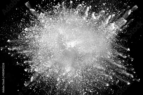 Fotomural Freeze motion of white dust explosion on black background