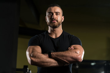 Portrait Of A Muscular Man In Black Shirt